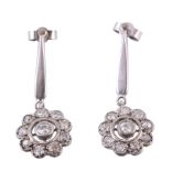 A pair of diamond ear pendents, the central old cut diamond in a cut down...  A pair of diamond