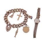 A curb link charm bracelet, with attached charms including a fish  A curb link charm bracelet,