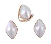 A mabe pearl ring, the marquise shape mabe pearl in a collet setting  A mabe pearl ring,   the