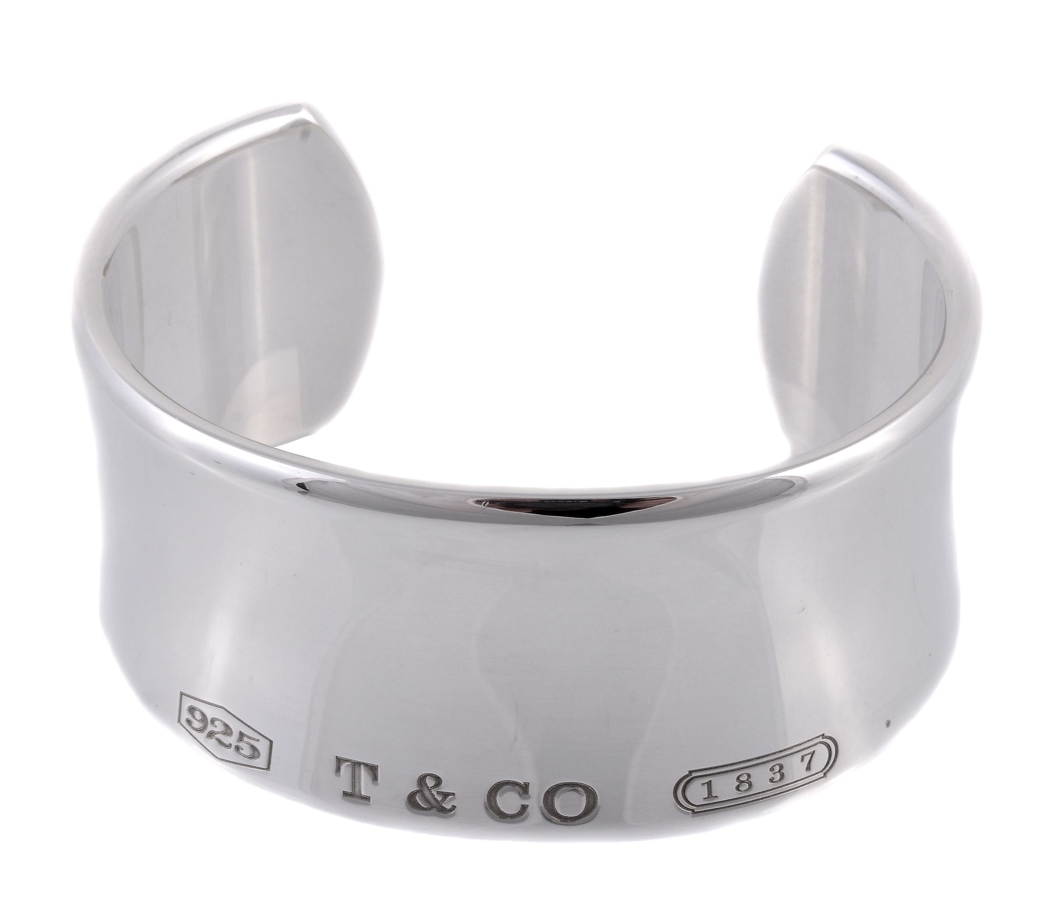 A silver cuff bangle by Tiffany and Co., the polished bangle signed Tiffany...  A silver cuff bangle - Image 2 of 2