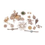 A small collection of gold jewellery , to include a charm bracelet...  A small collection of gold