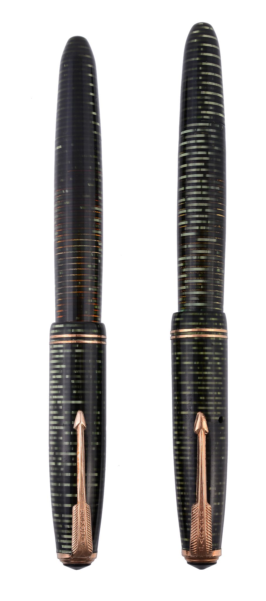 Two Parker green vacumatic pens, with a laminated emerald pearl finish  Two Parker green vacumatic