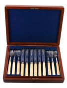 A mahogany case containing plated flatware, to include  A mahogany case containing plated flatware,