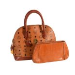 MCM, Heritage, a coated canvas bowler bag, with logo print to the outside  MCM, Heritage, a coated