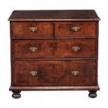 A walnut chest of drawers, circa 1710 and later  A walnut chest of drawers,   circa 1710 and