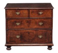 A walnut chest of drawers, circa 1710 and later  A walnut chest of drawers,   circa 1710 and