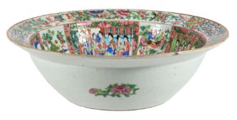 A large Cantonese basin, circa 1860, typically painted with panels of figures  A large Cantonese