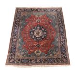 A Tabriz carpet, approximately 340cm x 253cm  A Tabriz carpet,   approximately  340cm x 253cm