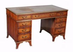 A walnut and brass bound twin pedestal desk, late 19th century  A walnut and brass bound twin