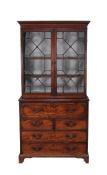 A George III mahogany secretaire-bookcase, circa 1790  A George III mahogany secretaire-