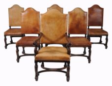 A set of twelve oak and leather upholstered dining chairs , 19th century  A set of twelve oak and