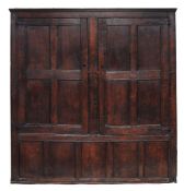 An oak panelled cupboard, 17th century and later  An oak panelled cupboard,   17th century and