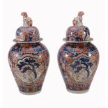 A Pair of Imari Vases and Covers, each of inverted baluster form with a...  A Pair of Imari Vases