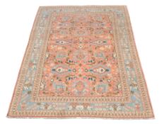 -108 A Persian carpet, with overall scrolling foliate design -108  A Persian carpet,    with overall