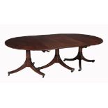 A mahogany triple pedestal extending dining table  A mahogany triple pedestal extending dining