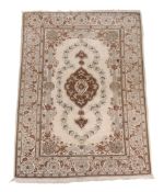 A Kashan rug , approximately 206cm x 135cm  A Kashan rug  , approximately 206cm x 135cm