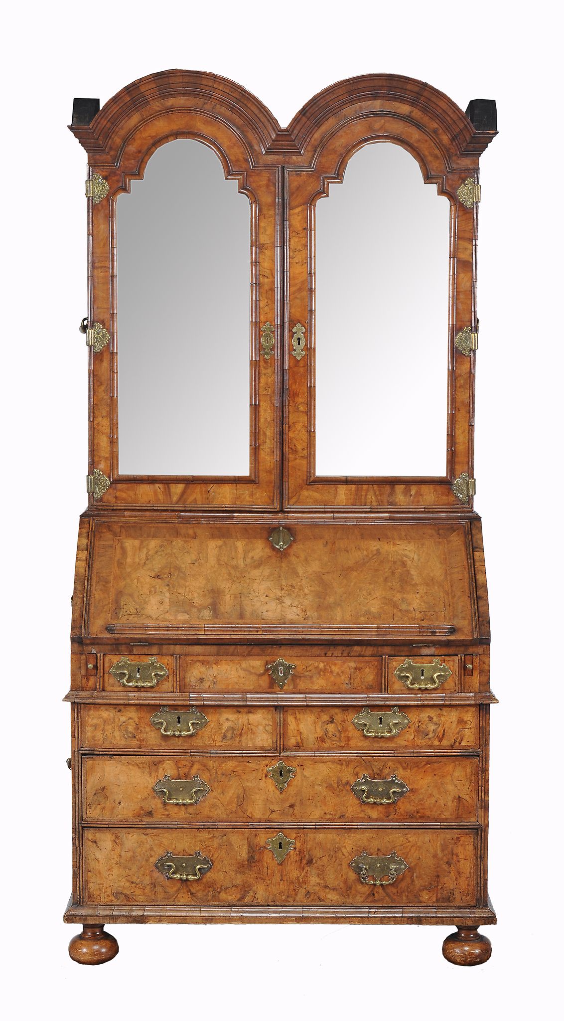 A Queen Anne figured walnut double dome top bureau bookcase , circa 1710  A Queen Anne figured