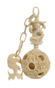 A Chinese ivory puzzle ball, late 19th/early 20th century  A Chinese ivory puzzle ball, late 19th/