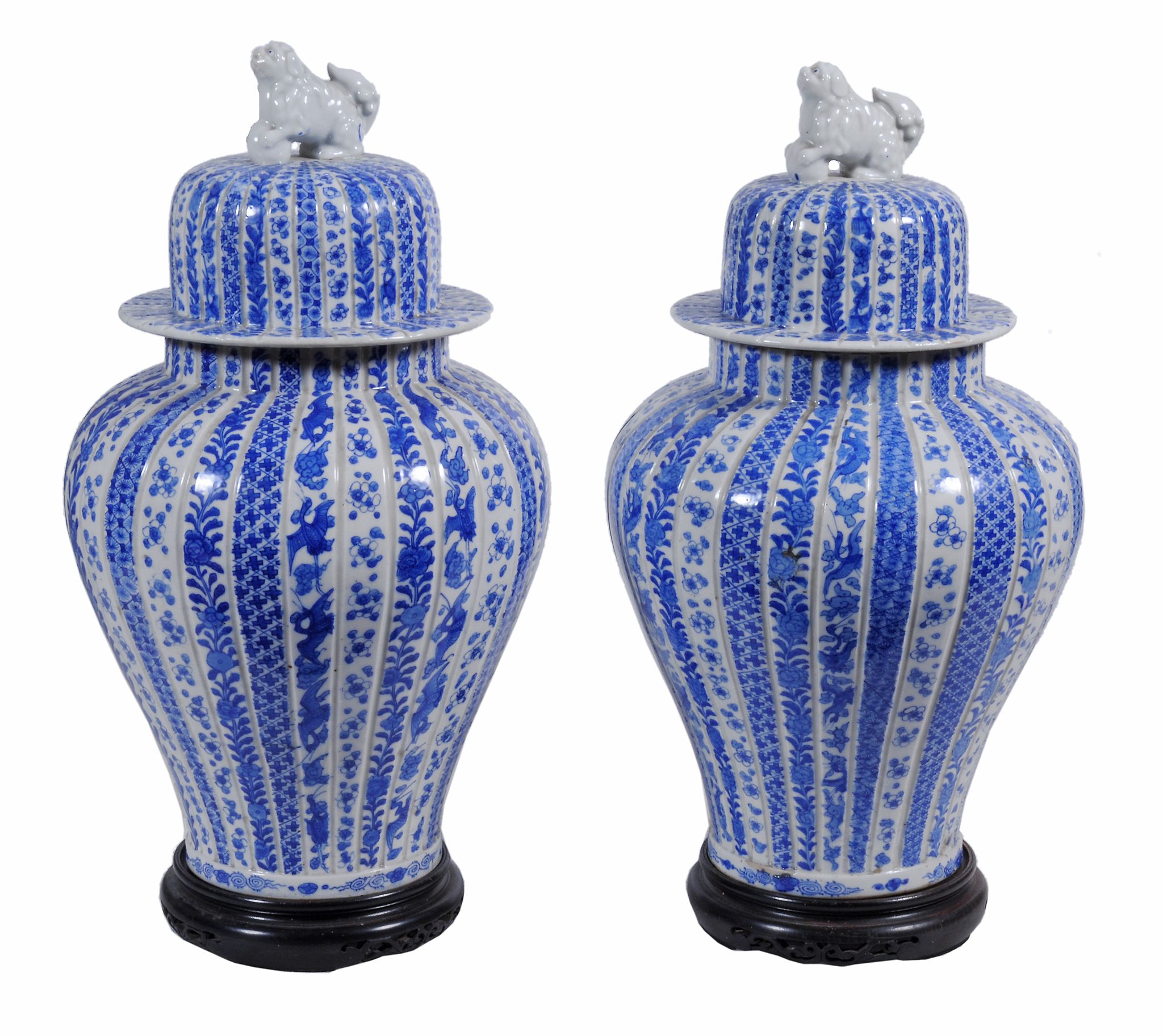 A pair of Japanese blue and white baluster vases and covers, 19th century  A pair of Japanese blue