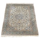 A large Persian carpet with floral border and floral field 350cm x 250cm  A large Persian carpet