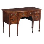 A George III mahogany bowfront sideboard, circa 1770, of serpentine outline  A George III mahogany