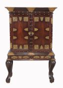 A late 19th century Ceylonese hardwood and brass mounted cabinet on stand  A late 19th century