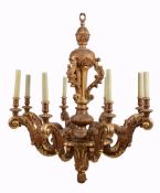 A carved and giltwood eight light chandelier in mid 18th century Italian taste  A carved and