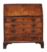 A George II walnut and burr walnut bureau, circa 1740  A George II walnut and burr walnut