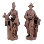 A pair of chinoiserie terracotta figures, 20th century  A pair of chinoiserie terracotta