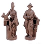 A pair of chinoiserie terracotta figures, 20th century  A pair of chinoiserie terracotta