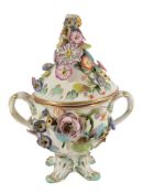 A Staffordshire porcelain flower-encrusted two-handled cup and cover with...  A Staffordshire