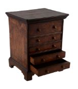 A miniature walnut and crossbanded chest of drawers, early 18th century  A miniature walnut and