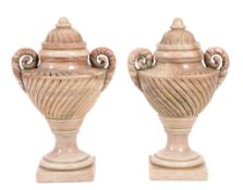 A pair of carved hardstone, probably jasper twin handled urns and covers  A pair of carved