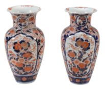 A Pair of Imari Vases, each of inverted baluster form rising to a wide neck...  A Pair of Imari