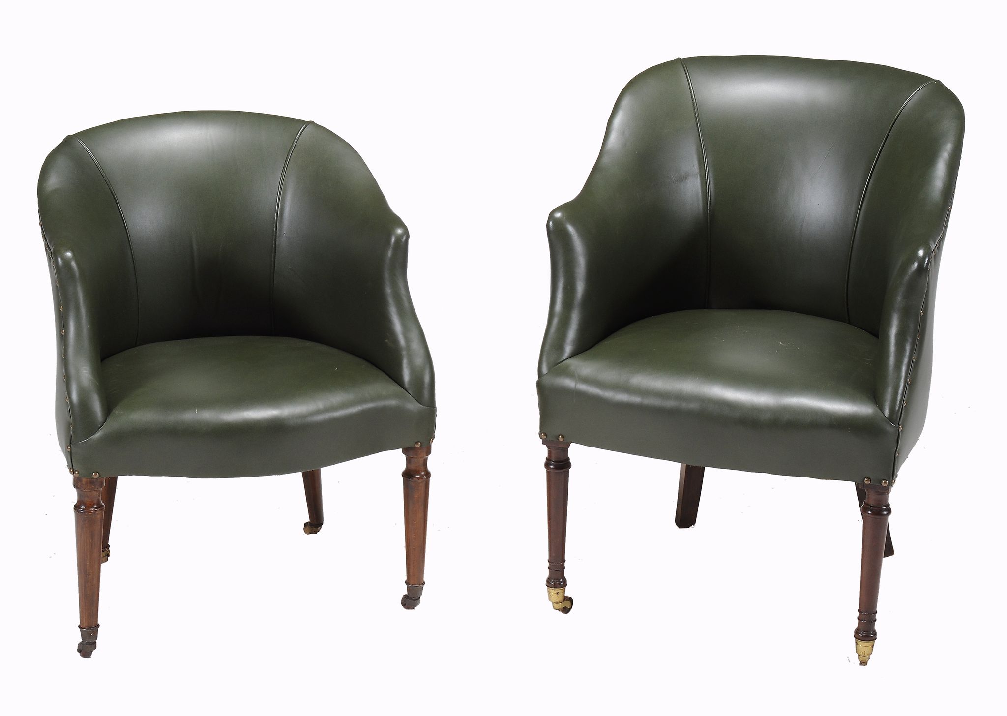 Two similar leather upholstered tub chairs in early 19th century style  Two similar leather