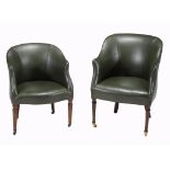 Two similar leather upholstered tub chairs in early 19th century style  Two similar leather