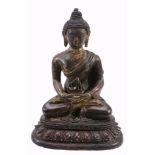 A gilt bronze seated figure of a Buddha , seated on double lotus base, 13  A gilt bronze seated