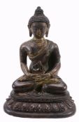 A gilt bronze seated figure of a Buddha , seated on double lotus base, 13  A gilt bronze seated