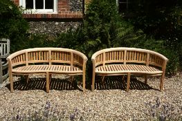 A pair of teak garden benches, of recent manufacture  A pair of teak garden benches,   of recent