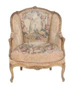 A giltwood and tapestry upholstered armchair in Louis XV style  A giltwood and tapestry
