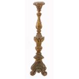 An Italian carved and giltwood altar candlestick, early 18th century  An Italian carved and giltwood