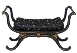 An ebonised and gilt x-frame window seat in Regency style , 20th century  An ebonised and gilt x-