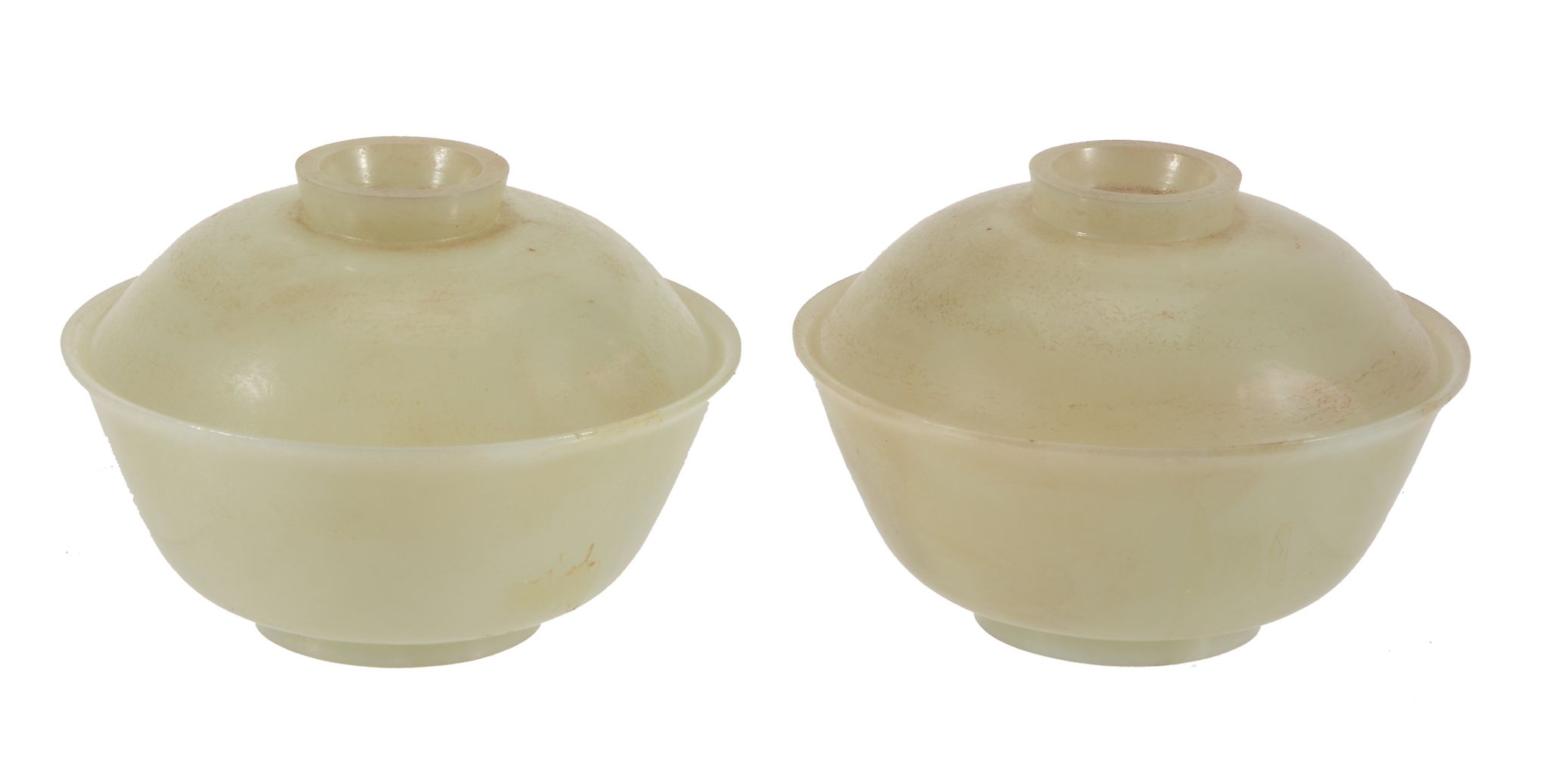 A pair of pale celadon jade bowls and covers , of flared circular shape  A pair of pale celadon jade