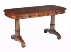 A George IV rosewood centre table, circa 1825, of rounded rectangular form  A George IV rosewood