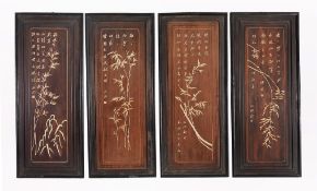 A set of four ivory inlaid hardwood panels, with bamboo and calligraphy  A set of four ivory