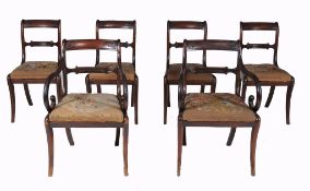 A set of six Regency dining chairs, circa 1815, to include two carvers  A set of six Regency
