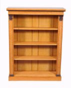 An early Victorian burr maple open bookcase, circa 1840, with pernambuco  An early Victorian burr
