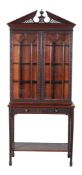 A mahogany Chippendale Revival display cabinet on stand  A mahogany Chippendale Revival display