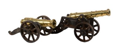 Two late Victorian brass and iron mounted models of canon, late 19th century  Two late Victorian