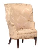 A mahogany upholstered wing armchair in George III style , 19th century  A mahogany upholstered wing
